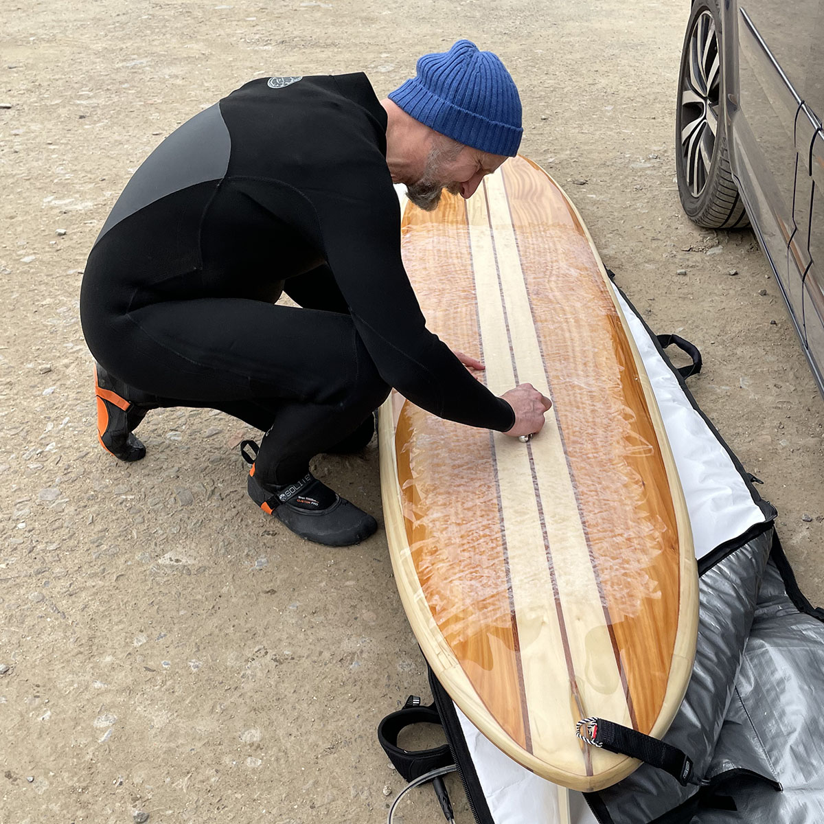 otter wooden surfboards waxing up