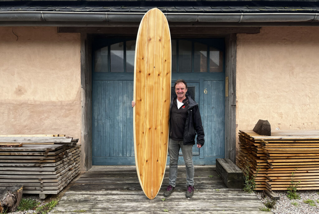 otter wooden surfboard blue doors