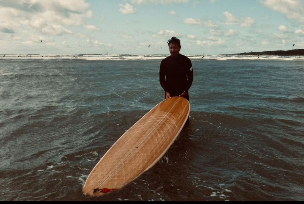 otter wooden surfboard waves surfer