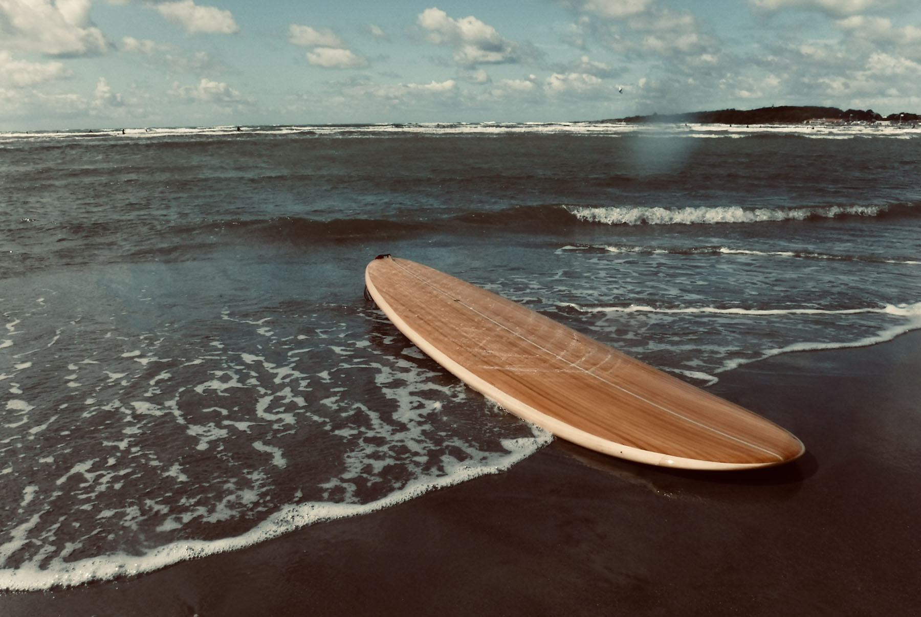 otter wooden surfboard waves