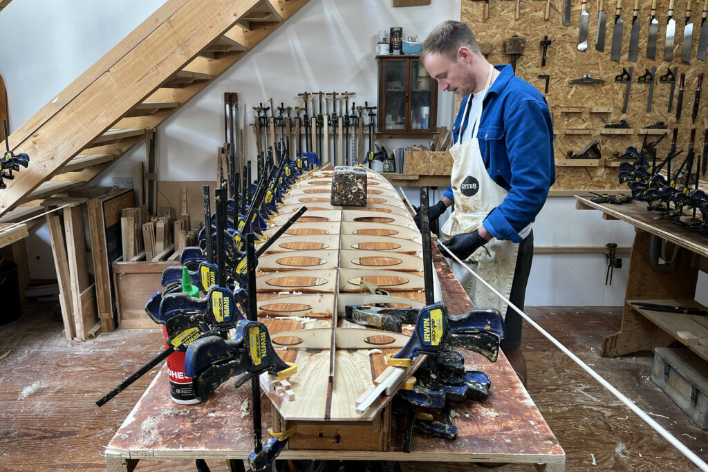 otter wooden surfboard workshop shaping