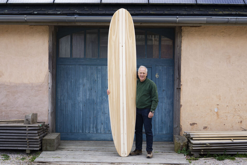 otter wooden surfboard blue doors