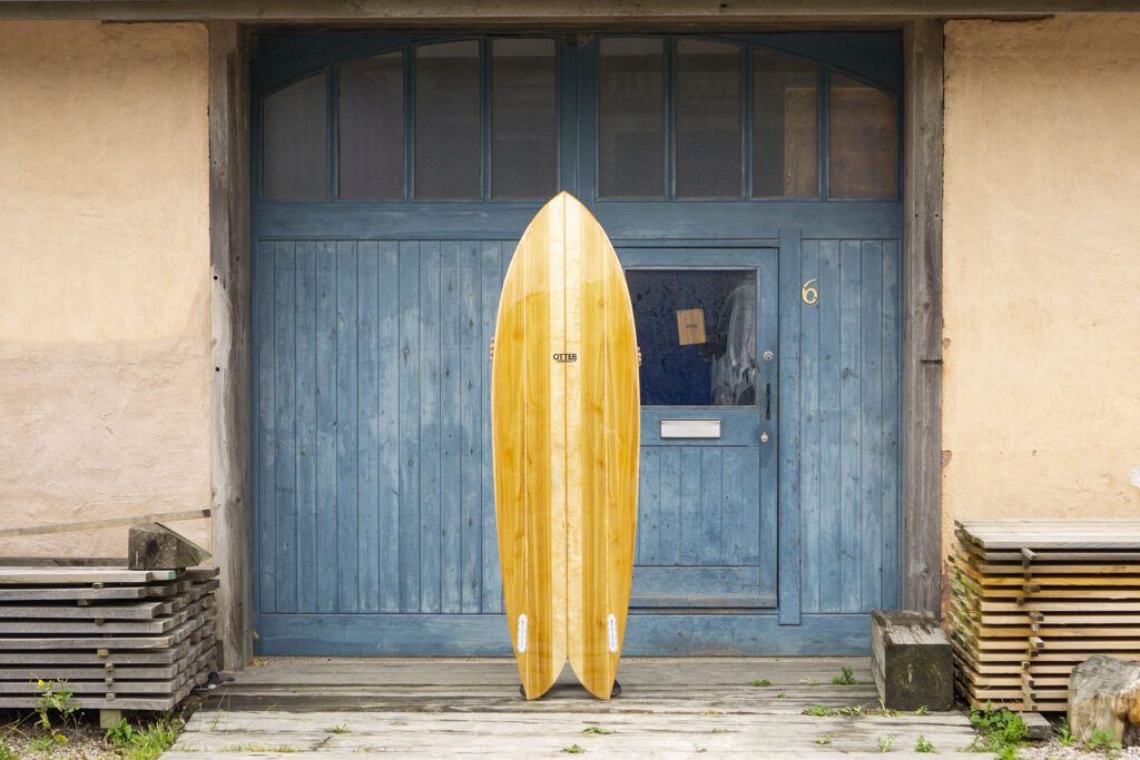 otter wooden surfboard fish