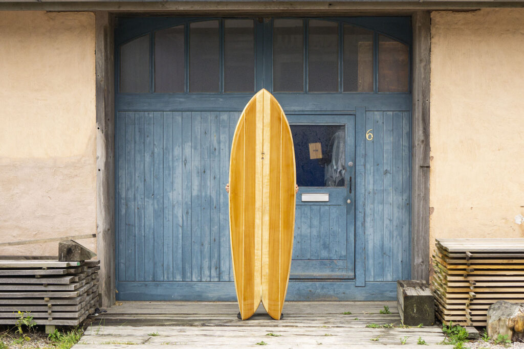 otter wooden surfboard fish