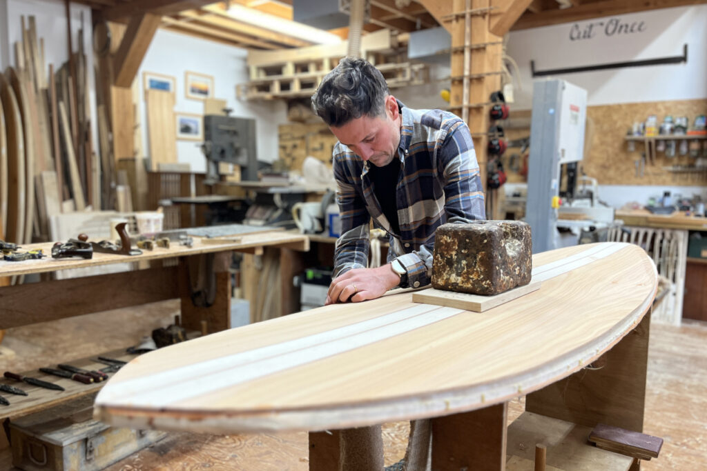 Gavin Otter Wooden Surfboard Coaster planing the rails