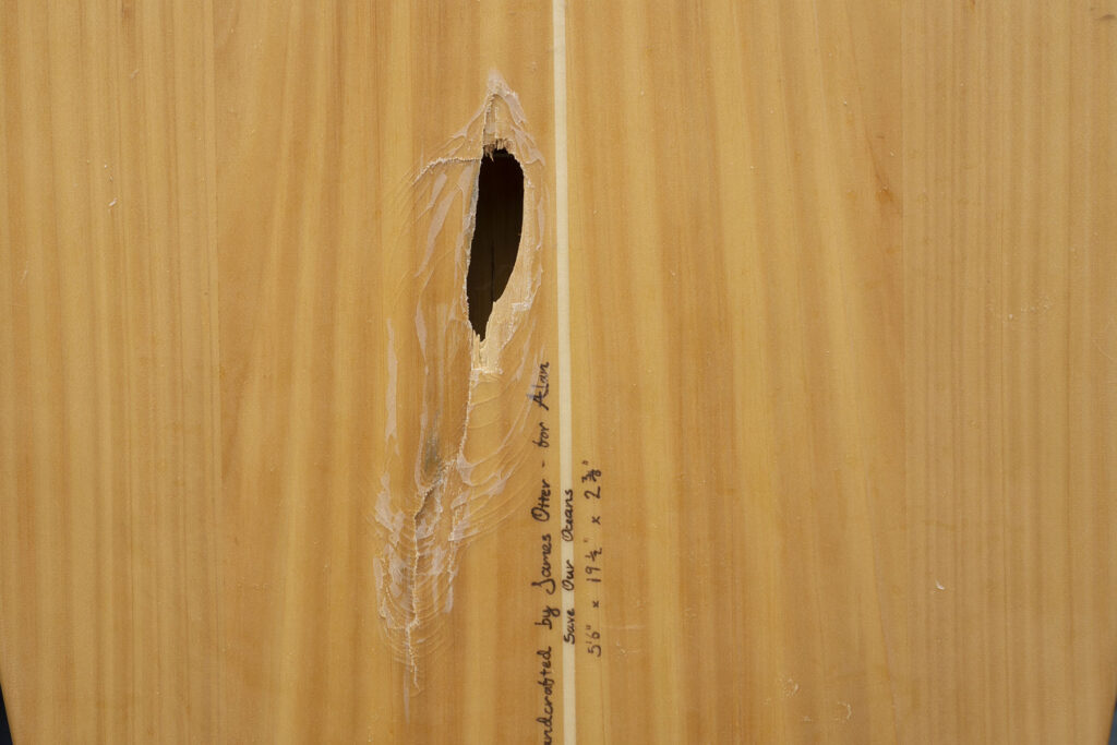 ding broken surfboard