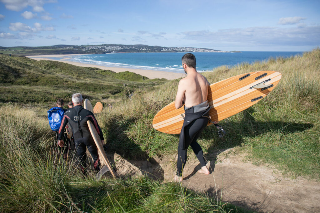otter wooden surfboard surfing sustainable beach