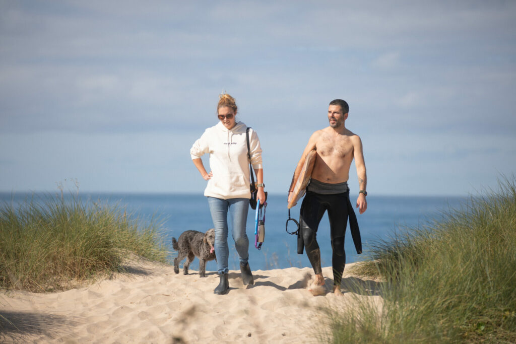otter wooden surfboard surfing sustainable beach