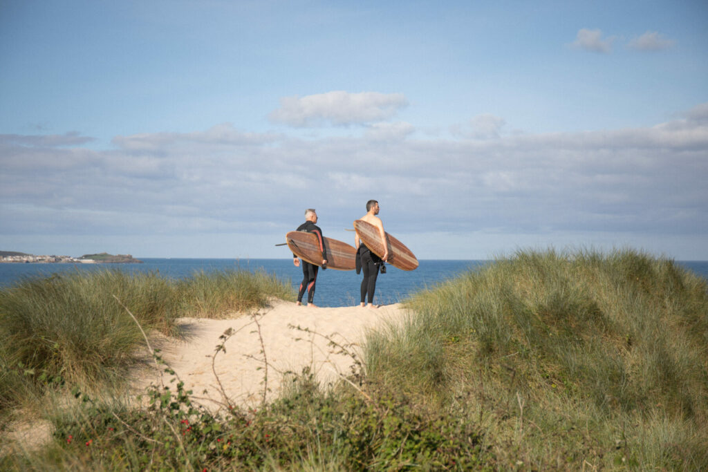 otter wooden surfboard surfing sustainable beach