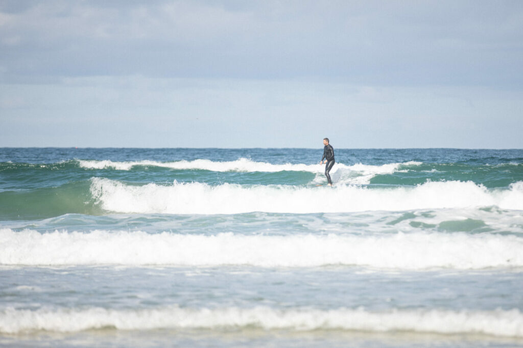 otter wooden surfboard surfing sustainable beach