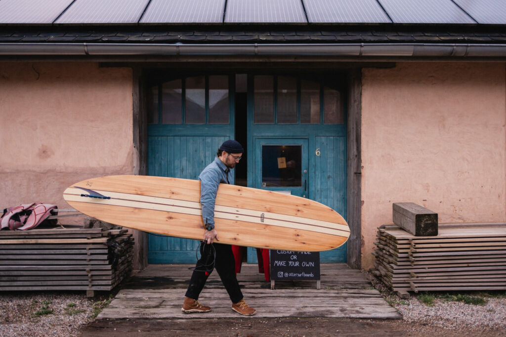 otter wooden surfboards longboard surfer blue doors vivobarefoot