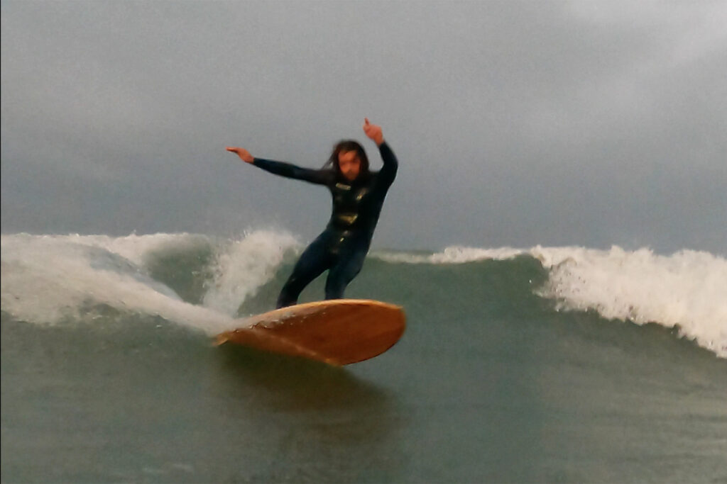 otter surfboards wooden surfboard surfer wave turn sustainable