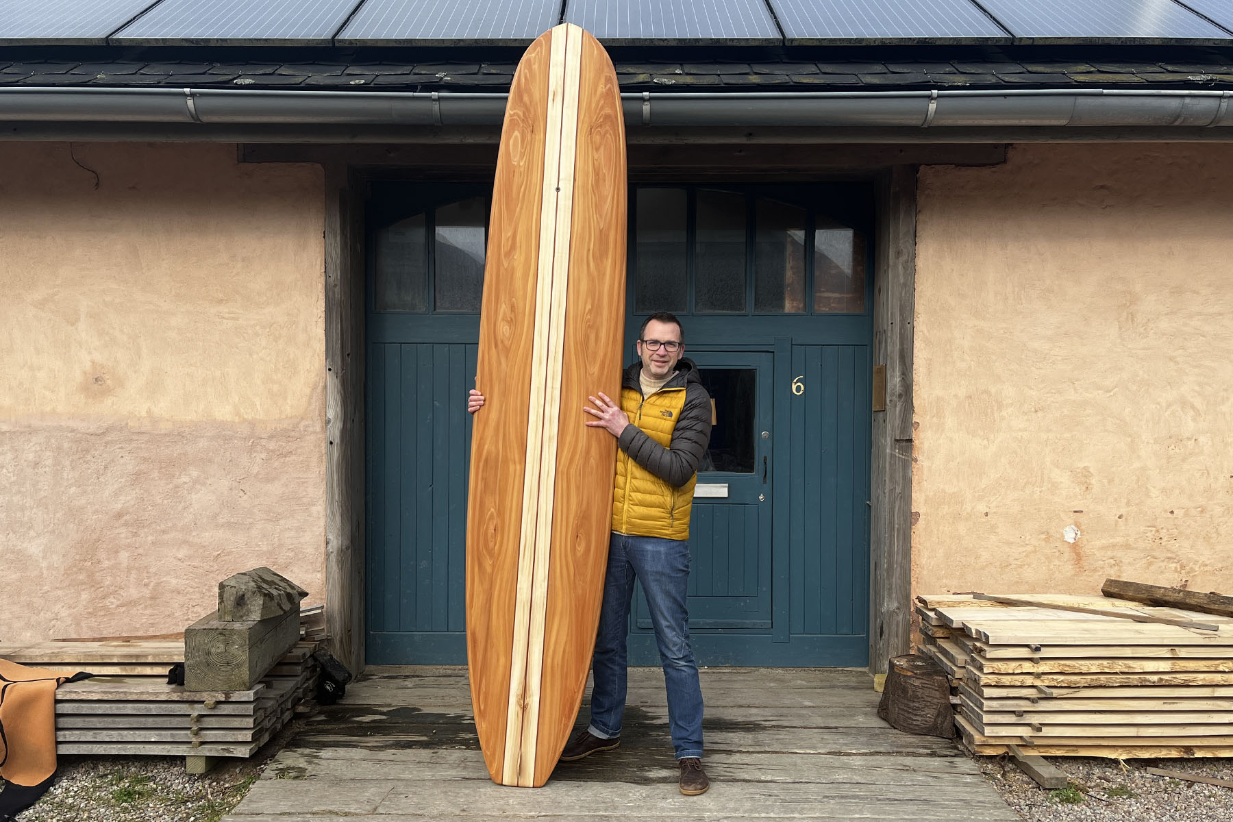 otter surfboards sustainable wooden workshop blue doors