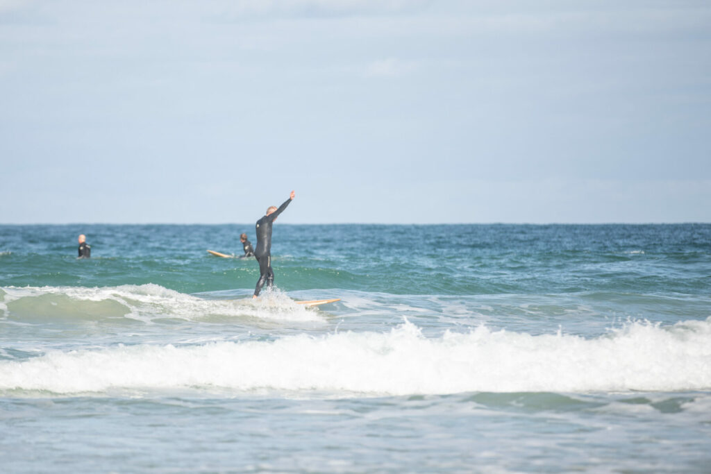 otter sustainable wooden surfboard surfer wave