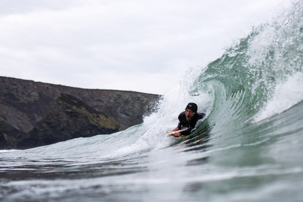 James Otter of Otter Surfboards slides into a barrel on his bellyboard