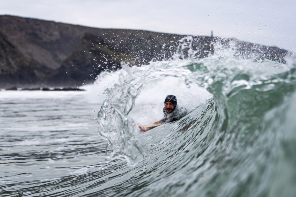 James Otter of Otter Surfboards slides into a barrel on his bellyboard