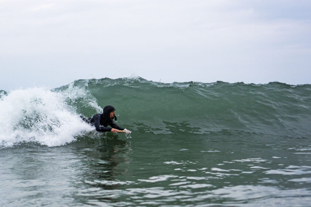 James Otter of Otter Surfboards slides into a barrel on his bellyboard
