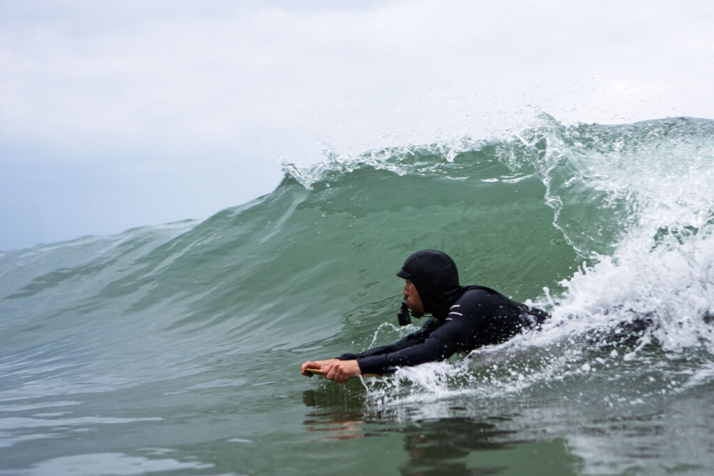 James Otter of Otter Surfboards slides into a barrel on his bellyboard