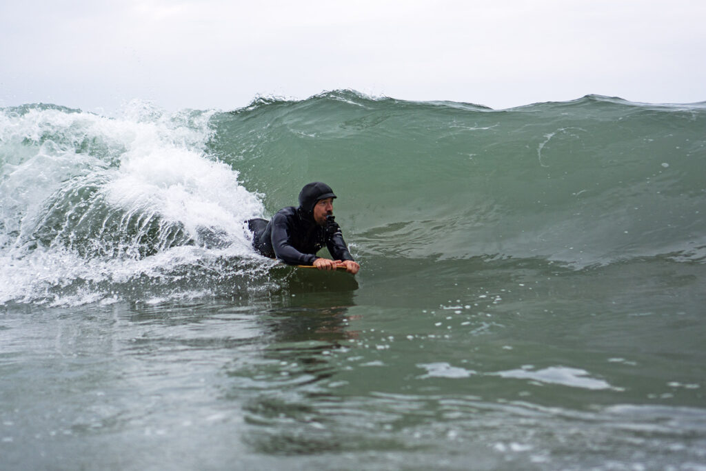 James Otter of Otter Surfboards slides into a barrel on his bellyboard