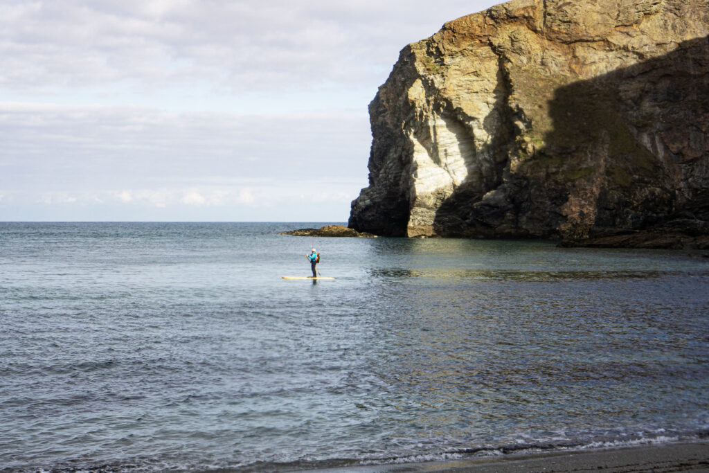 James Otter paddles one of his sustainable, wooden paddleboards.