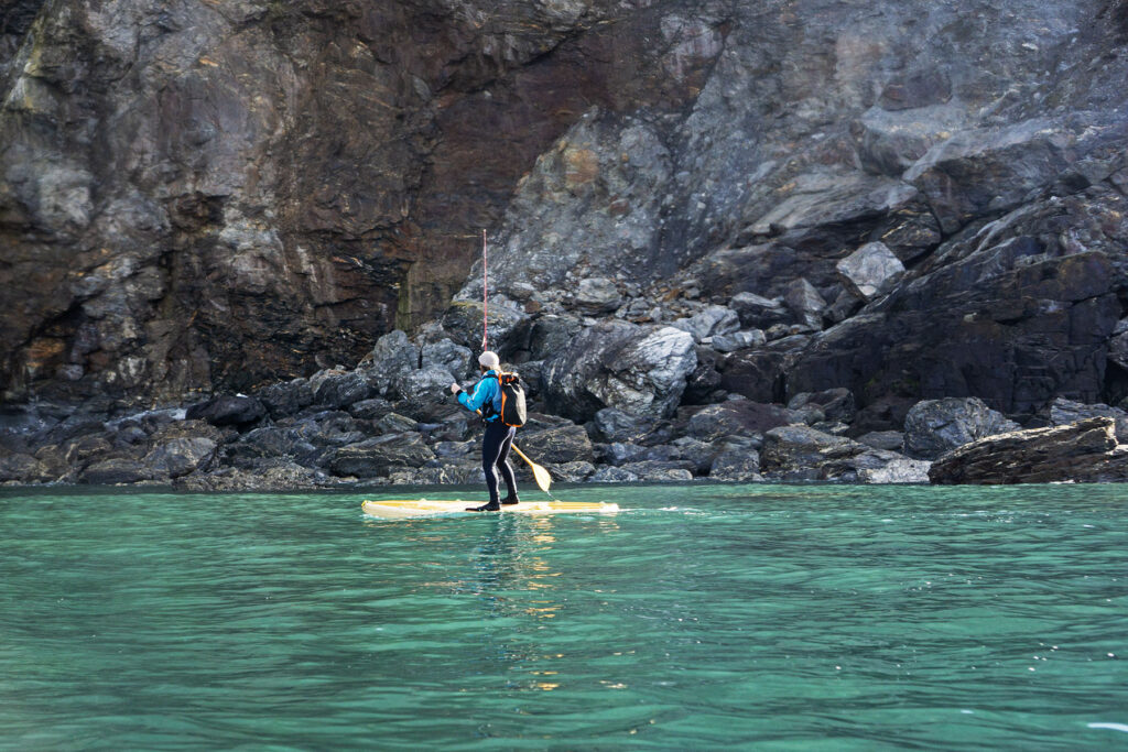James Otter paddles one of his sustainable, wooden paddleboards.