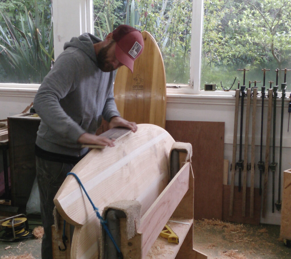 shane shapes his own sustainable, hollow wooden surfboard at Otter Surfboards