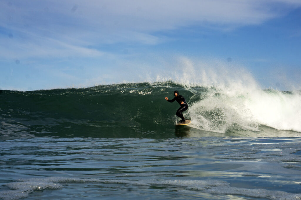 James Otter on a sustainable, hollow wooden surfboard