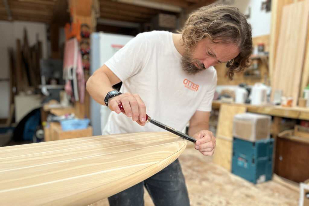 Shaping Otter Surfboards 9'1 Wicket hollow wooden surfboard