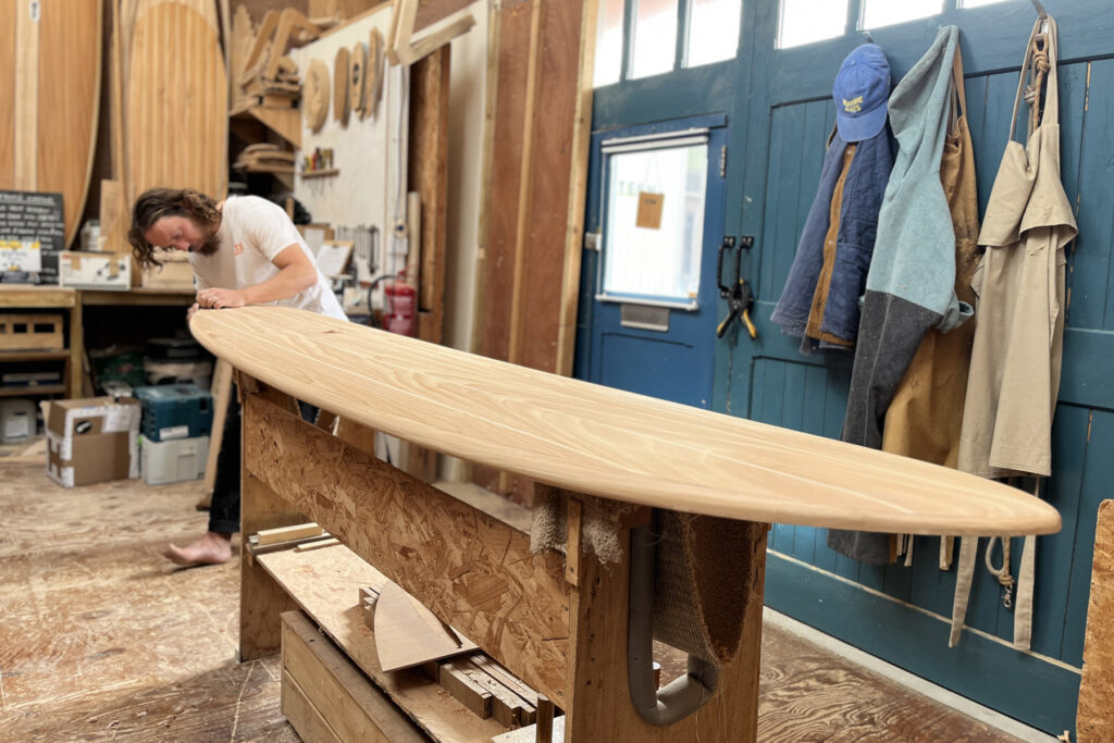 Shaping Otter Surfboards 9'1 Wicket hollow wooden surfboard