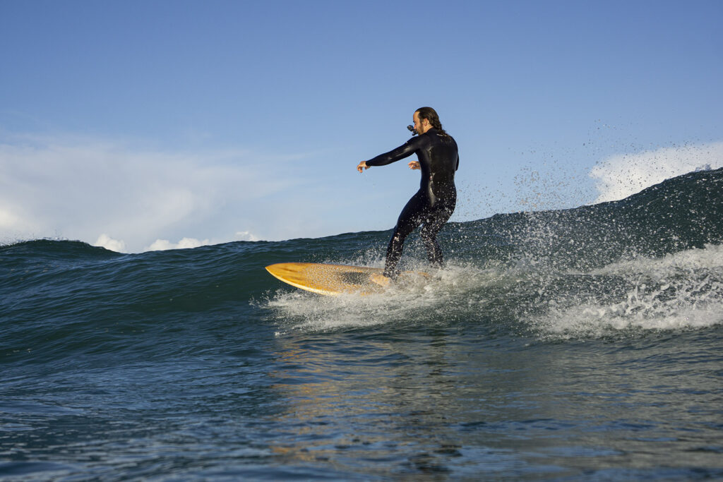 Surfing sustainable hollow wooden surfboards in Cornwall, UK