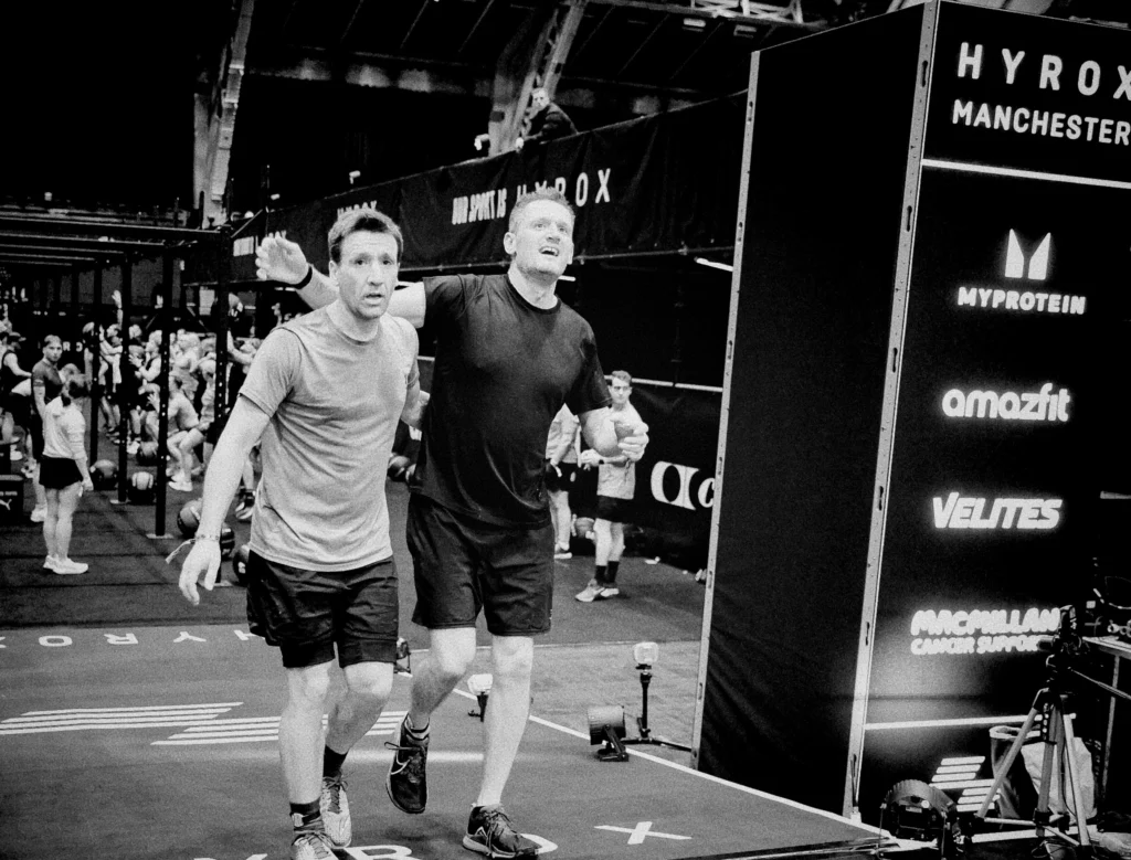 Two HYROX athletes finishing strong