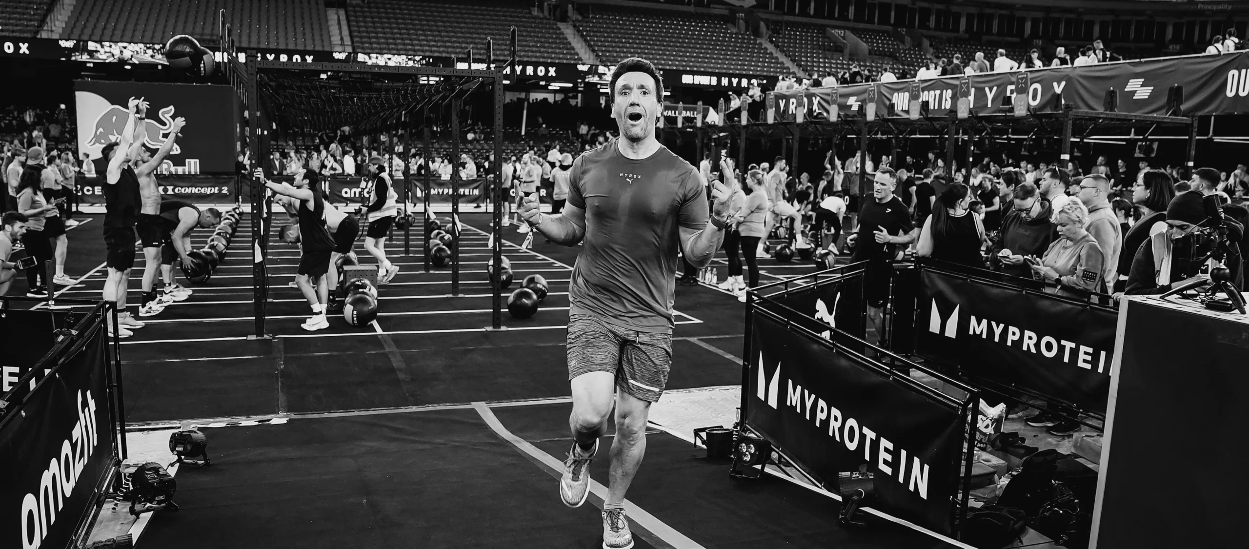 Athlete finishing final wall balls with visible fatigue and determination