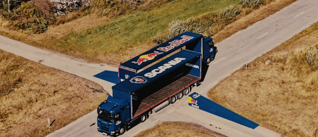 matt jones jumps through two scania driverless trucks
