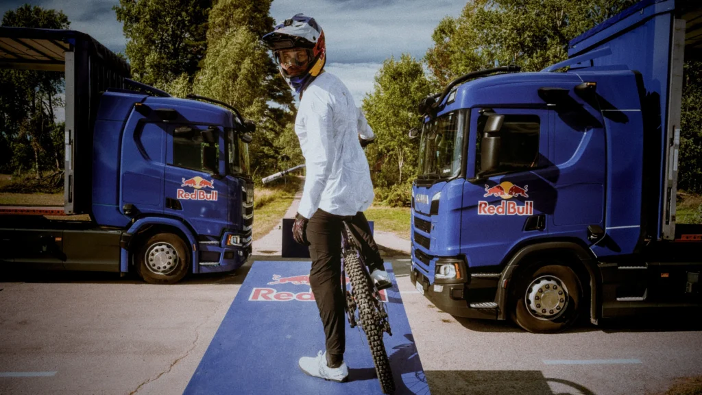 matt jones mountain bike positioned at takeoff with two trucks in the distance