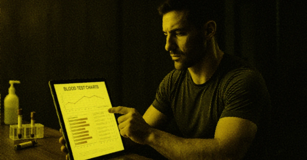 athlete sitting at a lab desk in a functional performance clinic reviewing blood test charts on a tablet alt