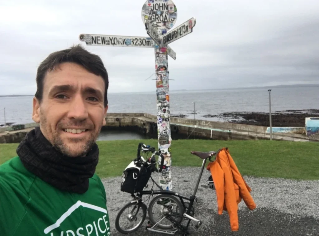 Richard and his Brompton during LEJOG, Land’s End or John o’ Groats landmark