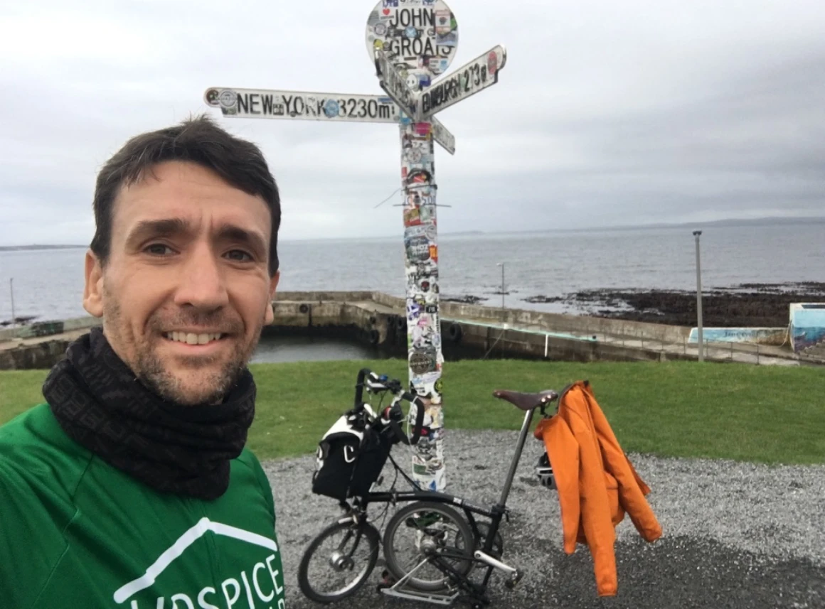 Richard and his Brompton during LEJOG, Land’s End or John o’ Groats landmark