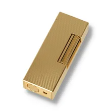 A gold dunhill lighter with barley textured design
