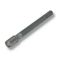 Fully assembled CC22 cigar punch and draw correction tool in gunmetal grey, featuring a slim cylindrical body, diamond-knurled grips and metal end fittings against a white background.