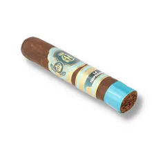 Crowned Heads La Imperiosa Magicos single loose cigar photographed diagonally against a white background, showing its dark brown Ecuadorian Habano Oscuro wrapper, ornate turquoise and gold Crowned Heads band with crowned emblem
