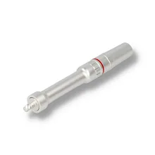 Fully assembled CC23 100mm cigar punch and draw correction tool photographed diagonally, showing its satin silver cylindrical body, ridged central grip, red decorative ring and metal end fittings.