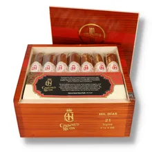Open polished reddish-brown wooden box of 21 Crowned Heads Mil Días Topes cigars, showing seven individually sleeved cigars across the front row with ornate cream and gold bands and red Crowned Heads emblems.