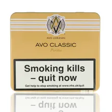 A cream coloured tin with Avo Uvezian branding and UK health warning labels