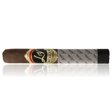 Las Villas By the Book Toro single cigar photographed diagonally on a white background, showing a dark brown wrapper, ornate black, gold and red Las Villas band.