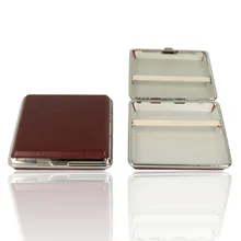 A picture of 2 cigarette cases, one is closed showing the leather effect finish and one is open showing the elasticated clasp inside.