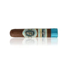 Crowned Heads La Imperiosa Magicos single loose cigar photographed diagonally against a white background, showing its dark brown Ecuadorian Habano Oscuro wrapper, ornate turquoise and gold Crowned Heads band with crowned emblem