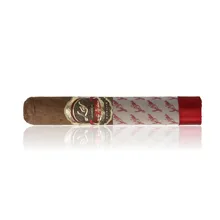 Las Villas Selección Box Pressed Robusto single cigar photographed diagonally on a white background, showing its dark brown wrapper, squared body, ornate burgundy and gold Las Villas band, white signature-printed protective sleeve and bright red ribbon