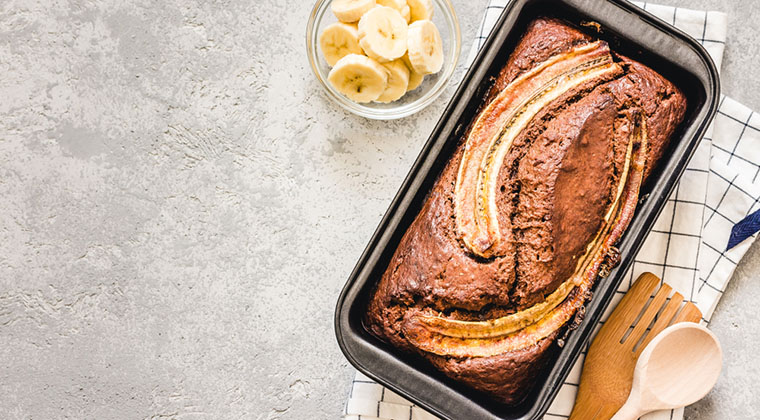 Cinnamon crunch banana bread on light concrete background.