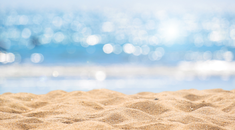 sandy beach sparkling blue sea