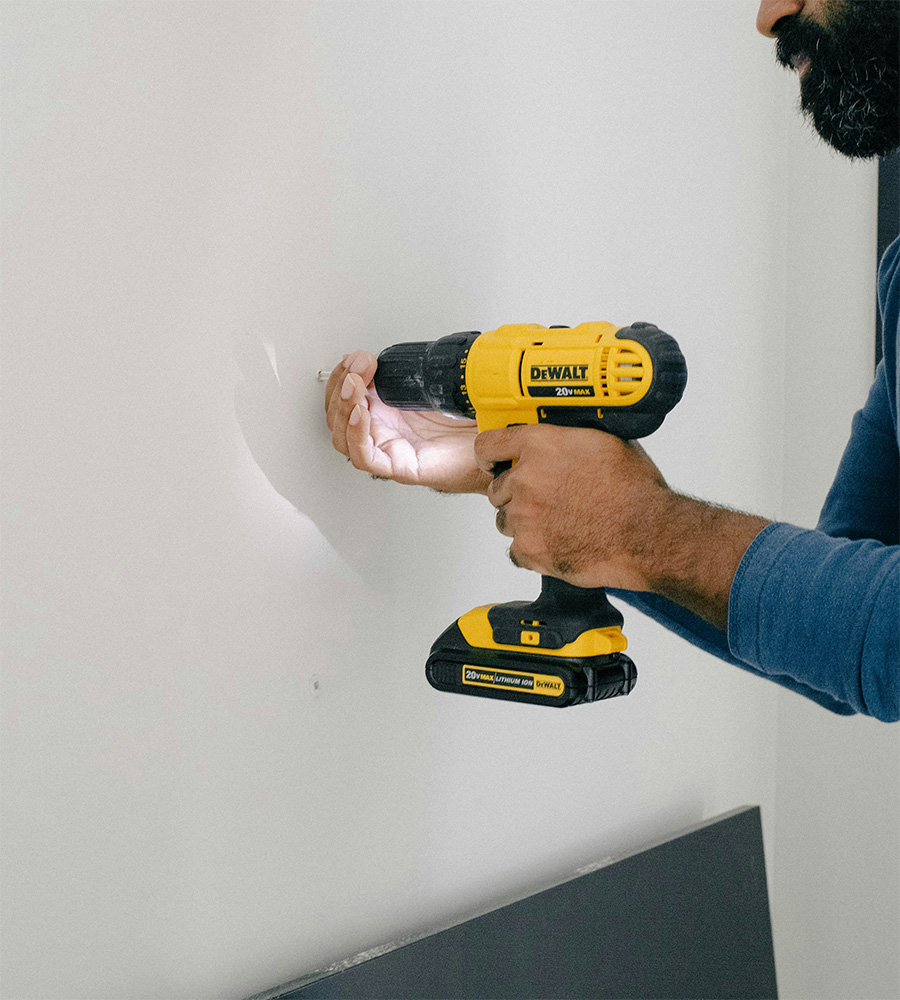 Persons using power drill